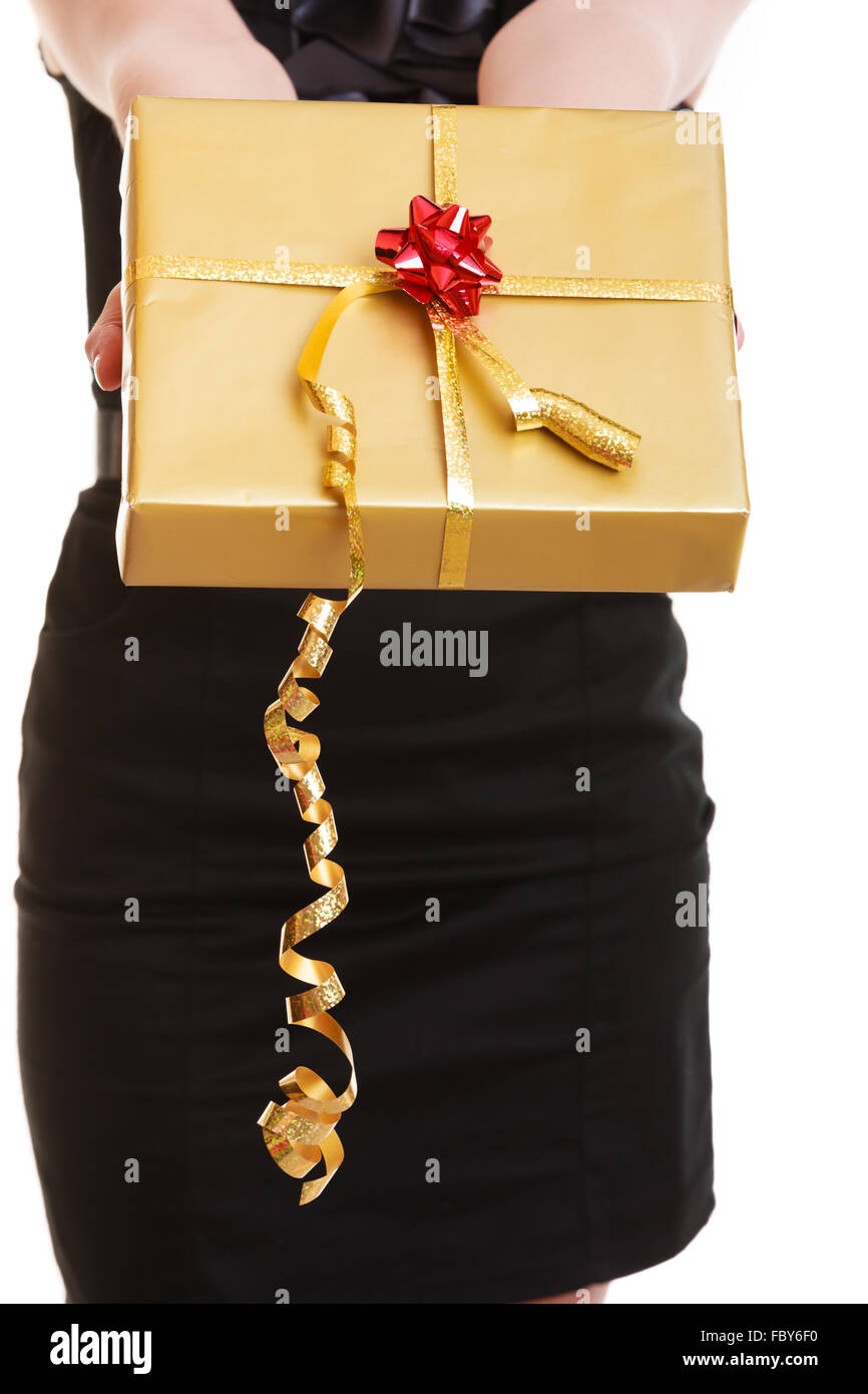 Female hands giving christmas golden gift box with ribbon. Holiday