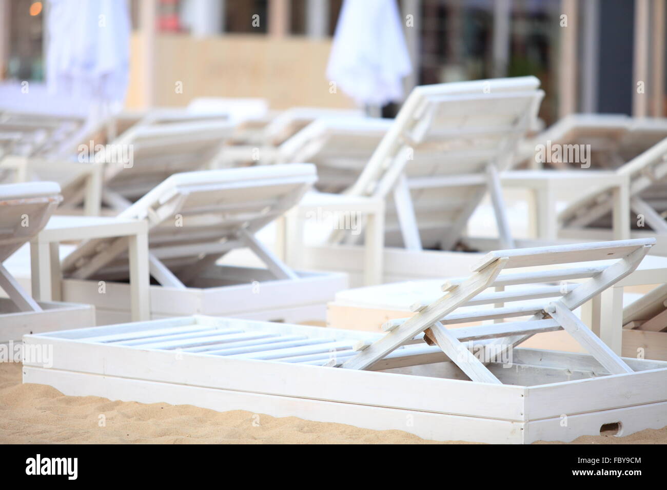 white pool chairs on sand beach Stock Photo Alamy