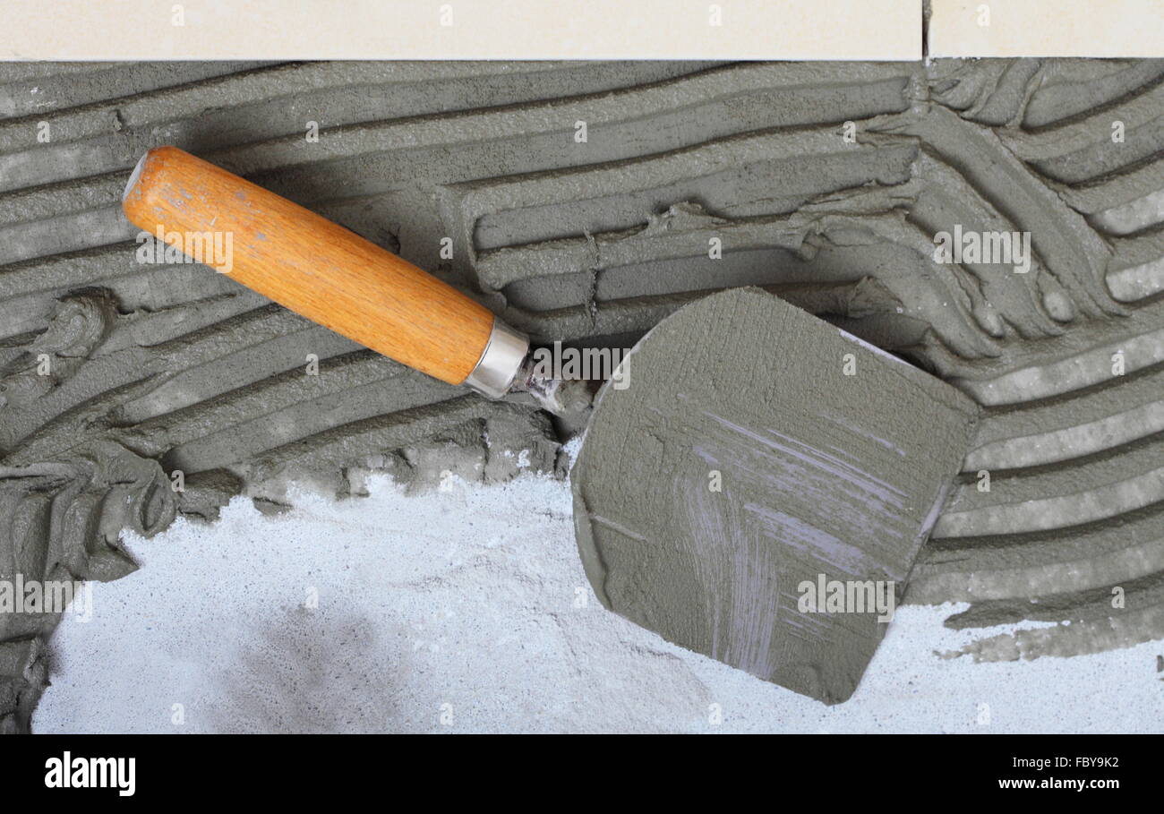 construction trowel with mortar for tiles work Stock Photo Alamy