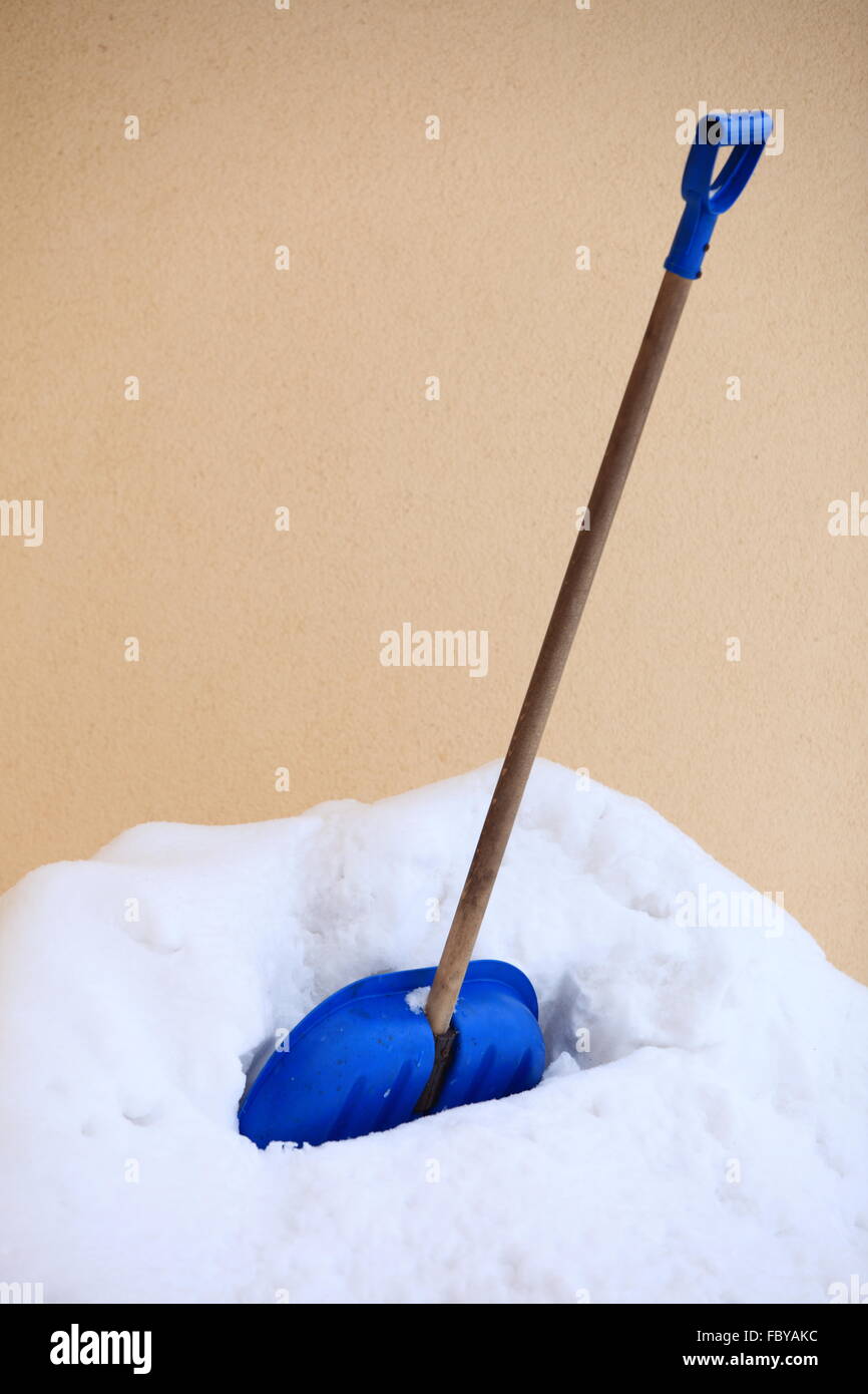 blue snow shovel standing up in deep snow Stock Photo - Alamy