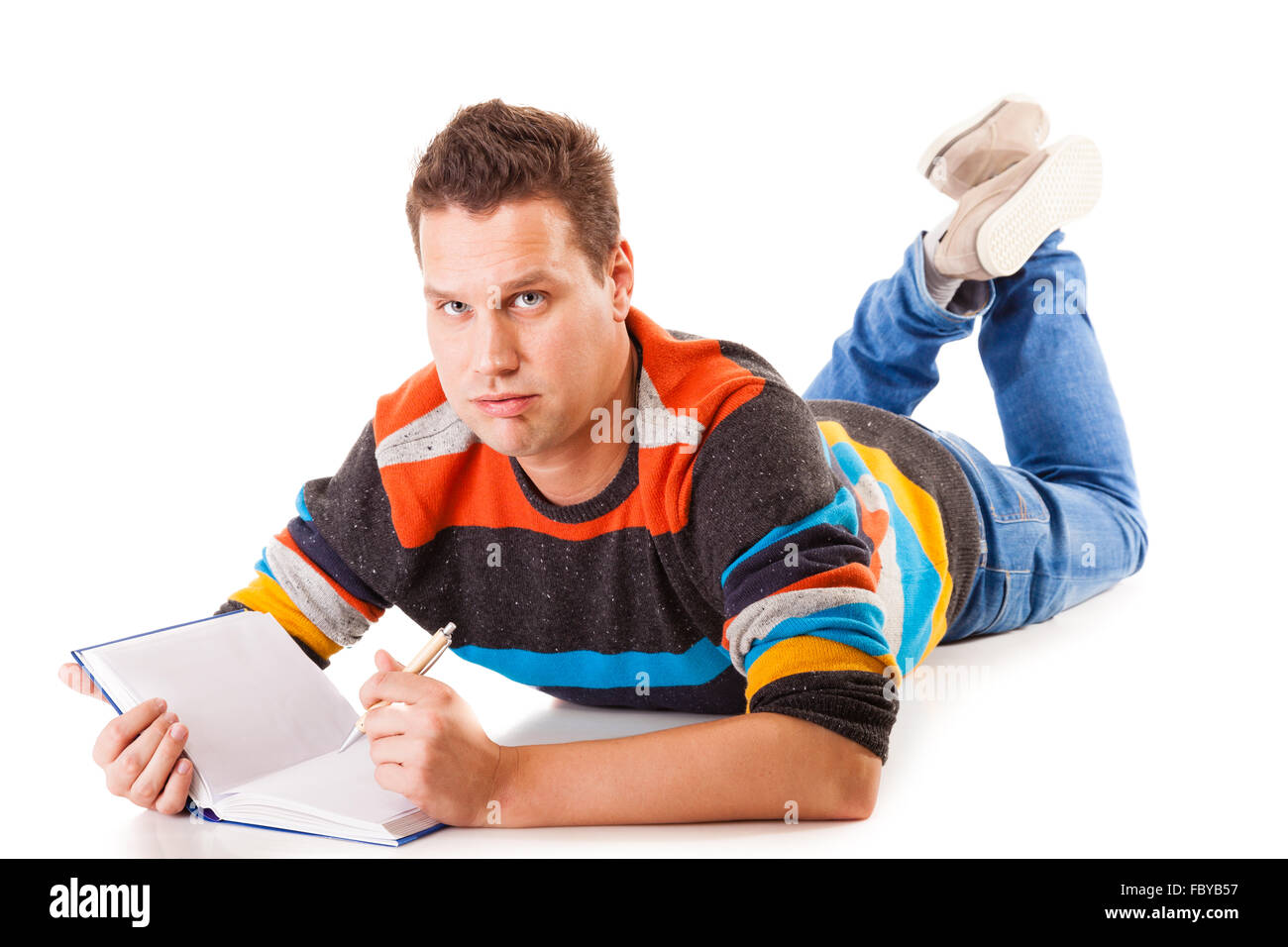 tired college student with book lying on floor preparing studying hard work for exam isolated on white background Stock Photo