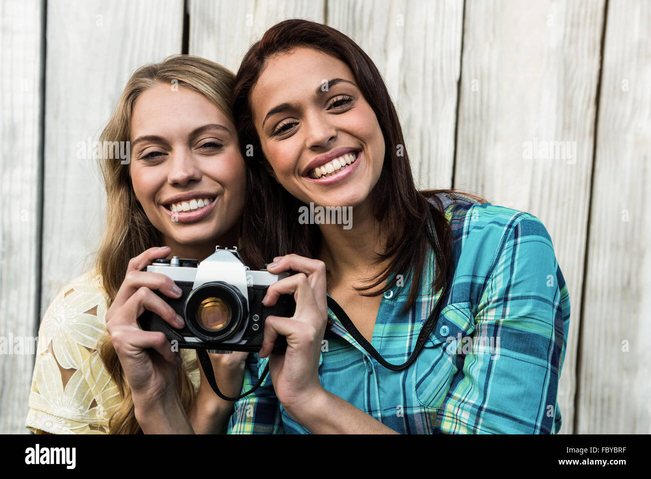 Two smiling female friends Stock Photo - Alamy