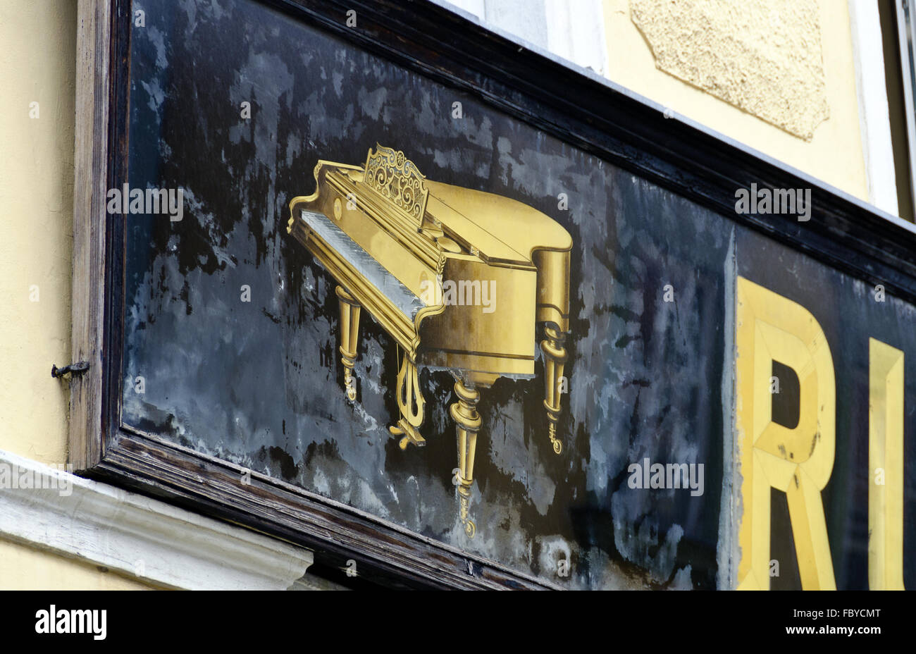 advertising panel with golden piano Stock Photo