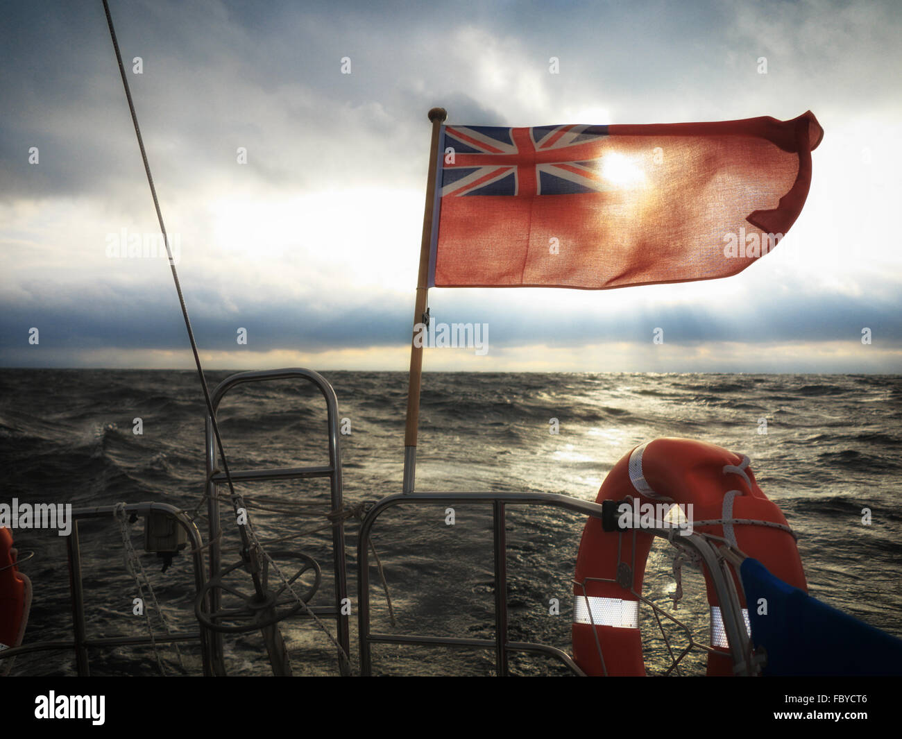 British maritime ensign flag boat and stormy sky Stock Photo Alamy