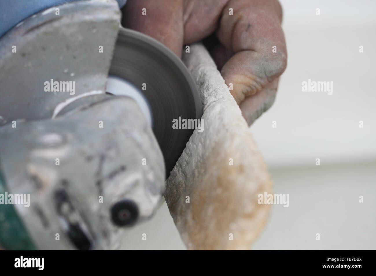 construction worker using an angle grinder cutting tile Stock Photo Alamy