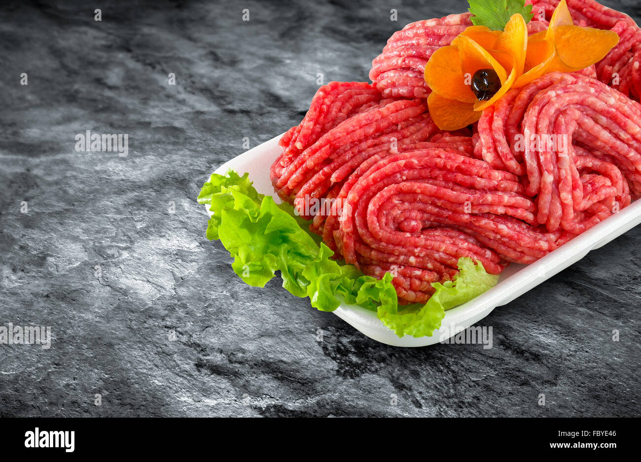 Fresh raw minced meat decorated with vegetables and clipping path Stock Photo