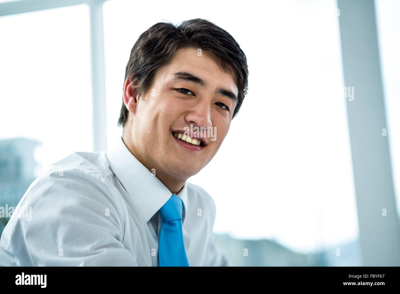 Happy smiling asian businessman Stock Photo - Alamy