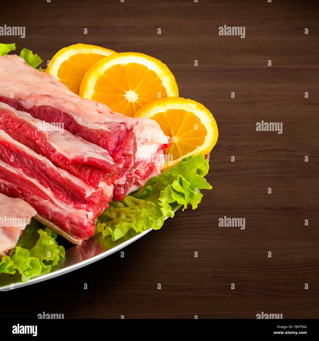 Fresh and raw meat. Ribs and pork chops uncooked, uncut ready to grill and barbecue with clipping path Stock Photo