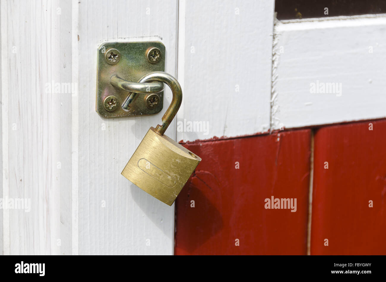 padlock at a wooden door Stock Photo