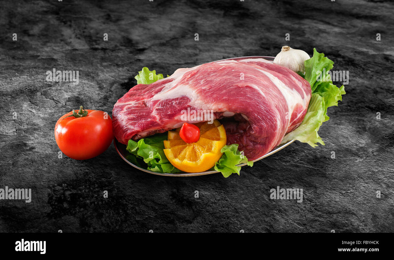 Fresh raw pork spare ribs decorated with vegetables and clipping path Stock Photo