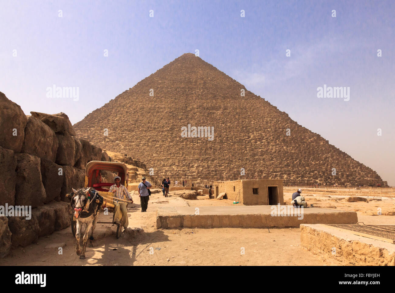 Tourist ride with horse and cart by pyramids Stock Photo