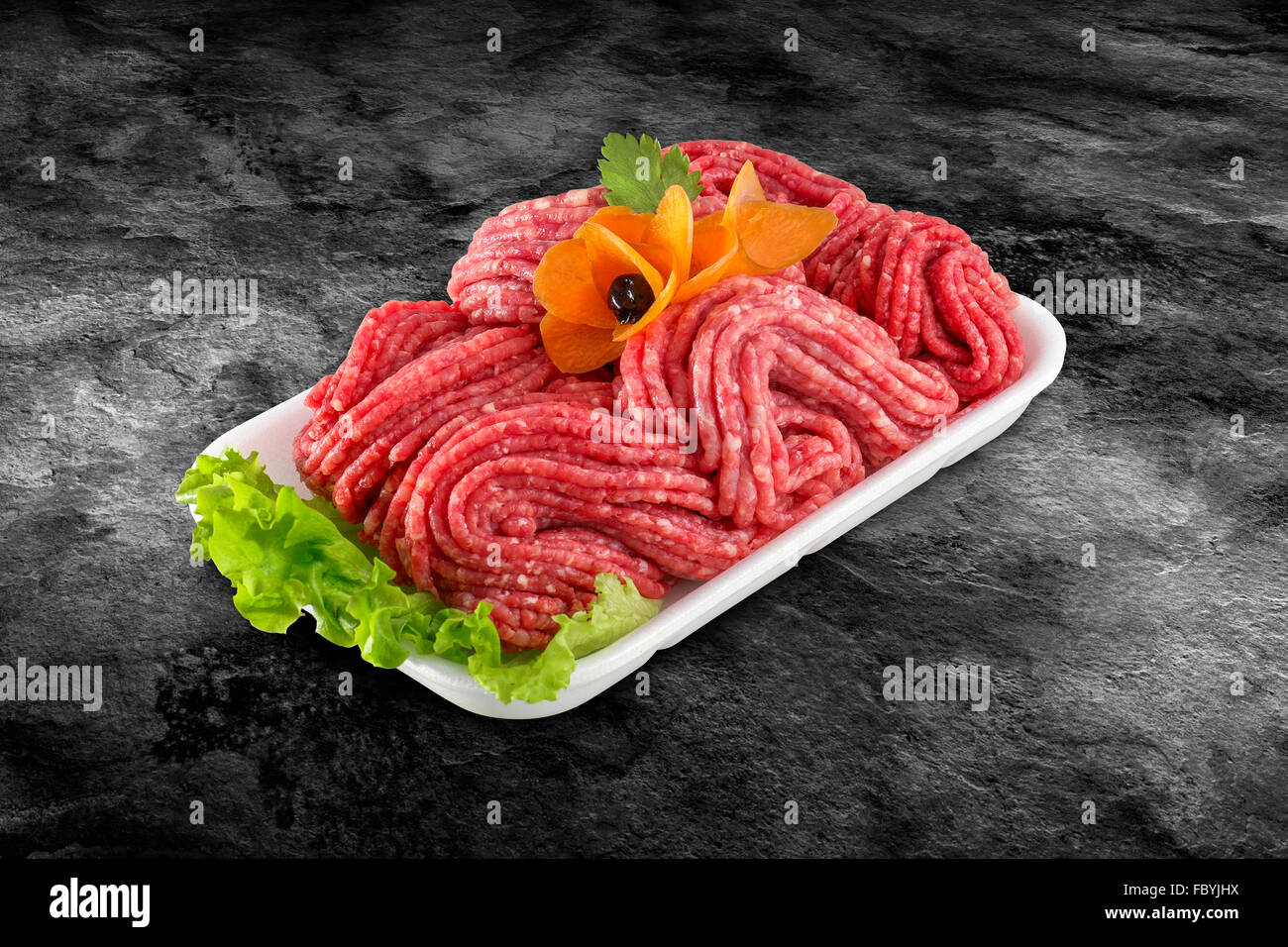 Fresh raw beef minced meat decorated with vegetables and clipping path Stock Photo