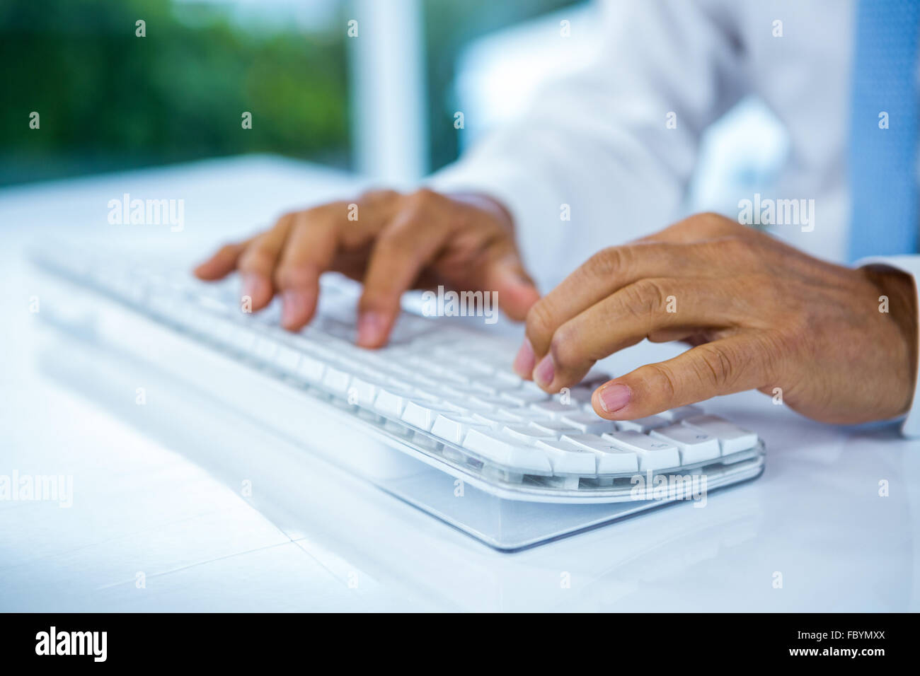 Businessman using his computer Stock Photo - Alamy