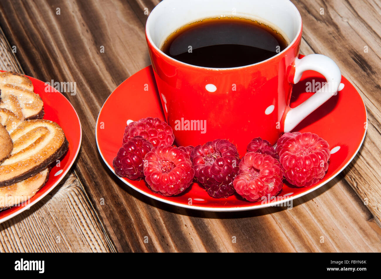 Ripe raspberry and coffee cup Stock Photo