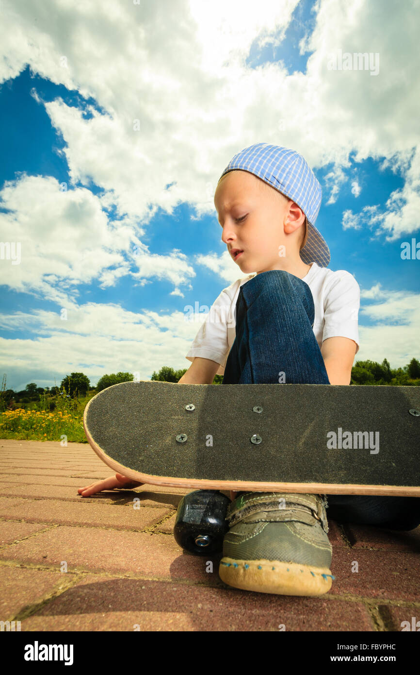Skater boy child with his skateboard. Outdoor activity Stock Photo Alamy