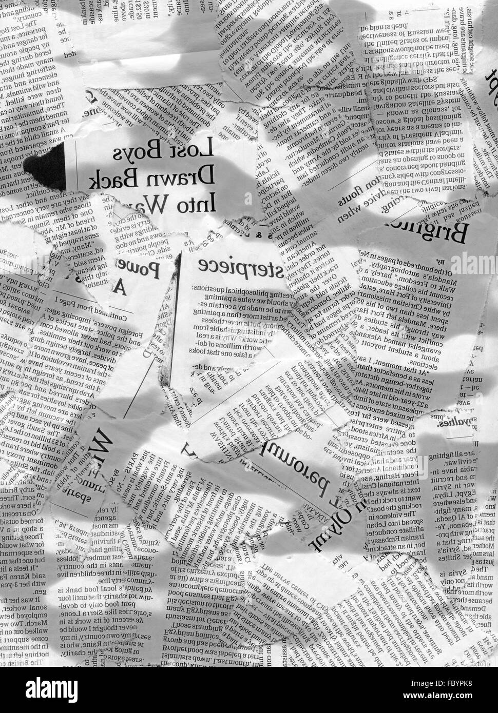 scraps of newspapers with light and shadows Stock Photo