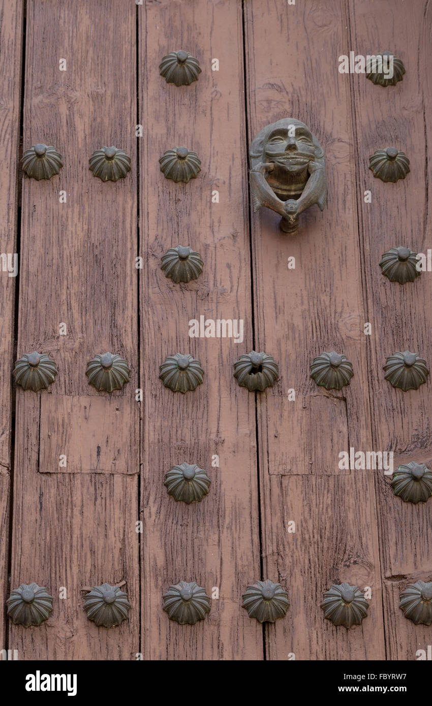 Heavy wooden door of Templo del Ex-Hospital de San Juan de Dios, a 17th century Roman Catholic Church in Puebla Mexico. Stock Photo