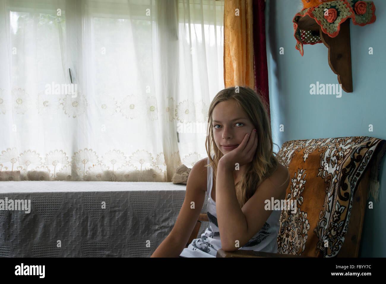 portrait of a girl in his home in the district of Maramures, Romania Stock Photo