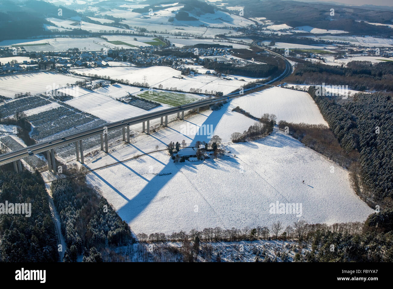 Aerial view, highway bridge A46 Wennemen with snow and long shadows, Meschede, Sauerland, North Rhine-Westphalia, Germany,Europe Stock Photo