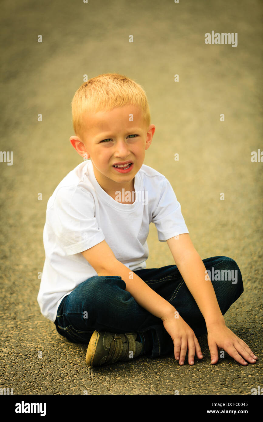 Little thoughtful boy child portrait outdoor Stock Photo