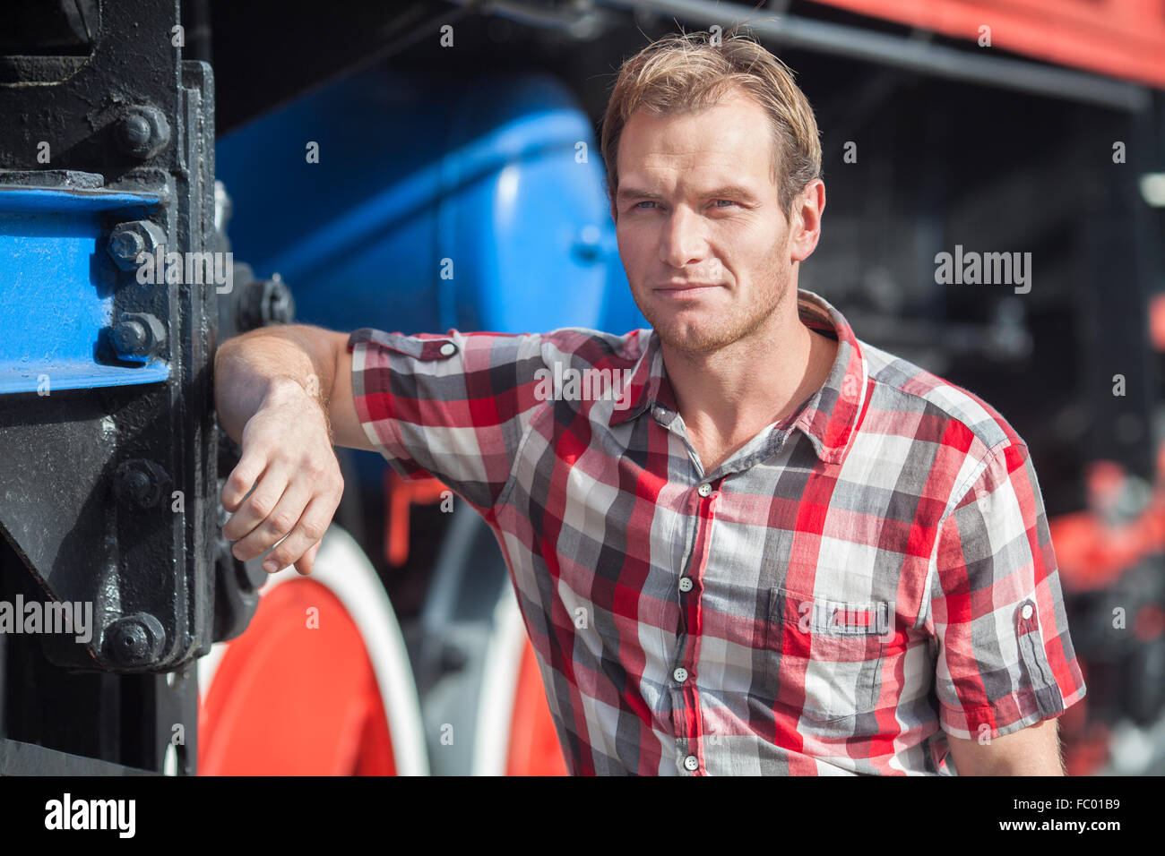Portrait of man in a checkered shirt. Outdoor shoot Stock Photo