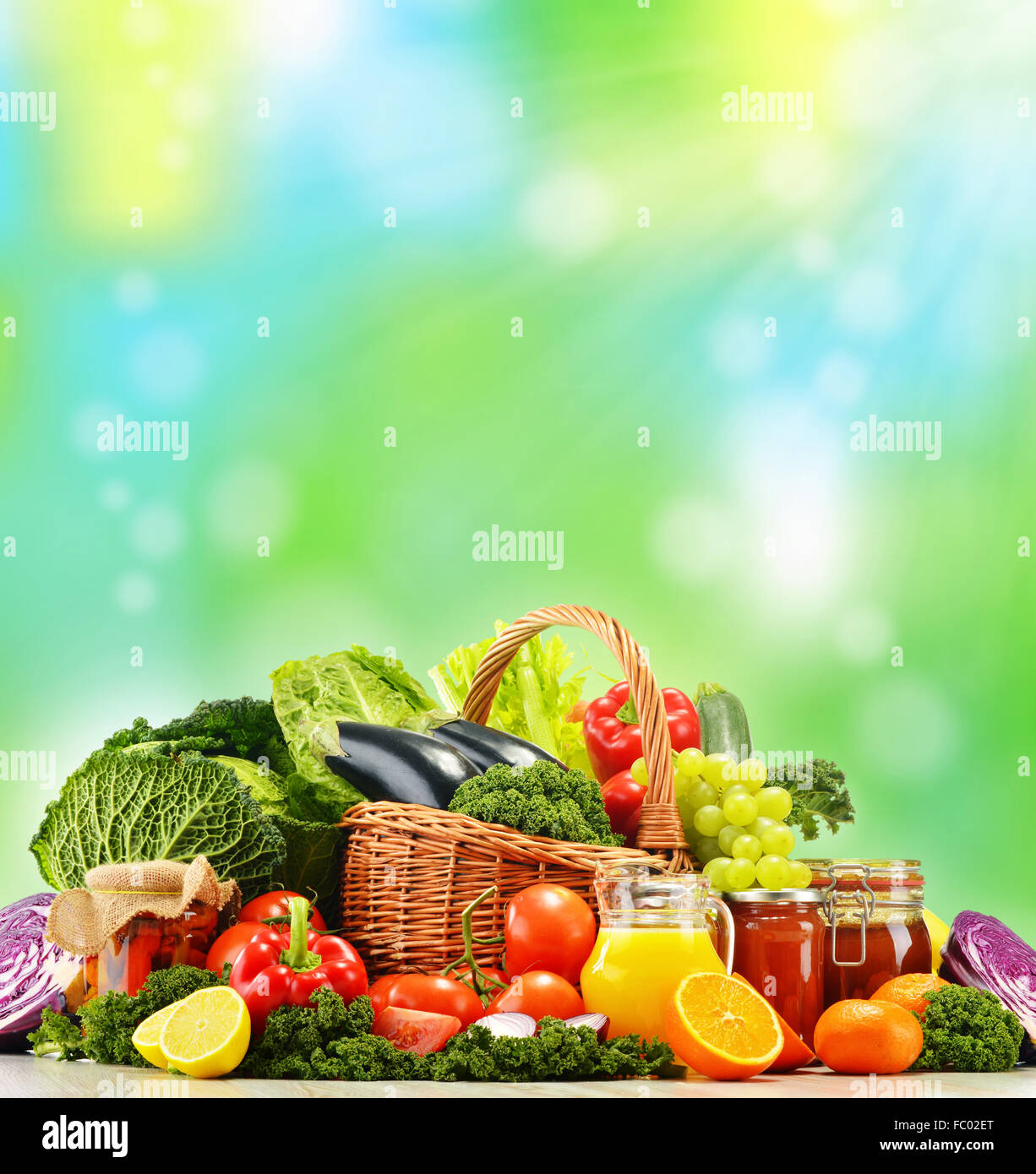 Wicker basket with assorted organic vegetables and fruits isola Stock ...