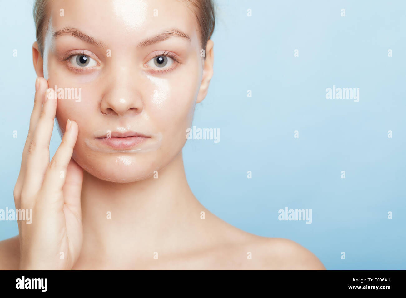 Girl woman in facial peel off mask. Skin care Stock Photo Alamy