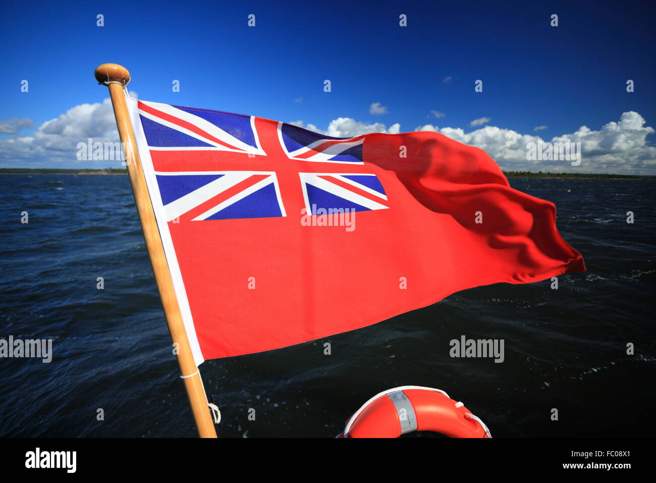 British maritime red ensign flag blue sky Stock Photo Alamy
