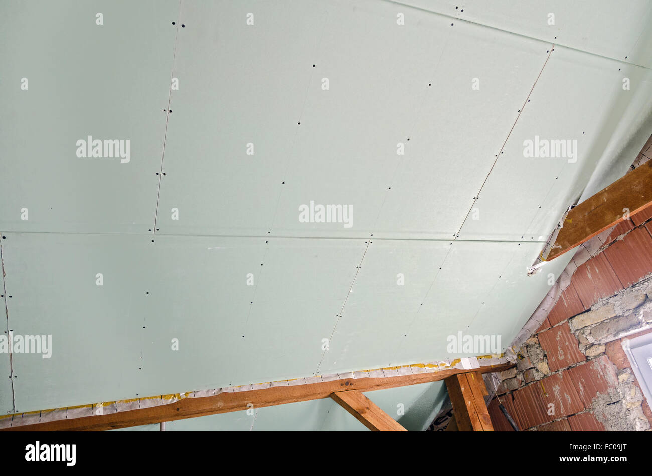 attic with plasterboard under construction Stock Photo