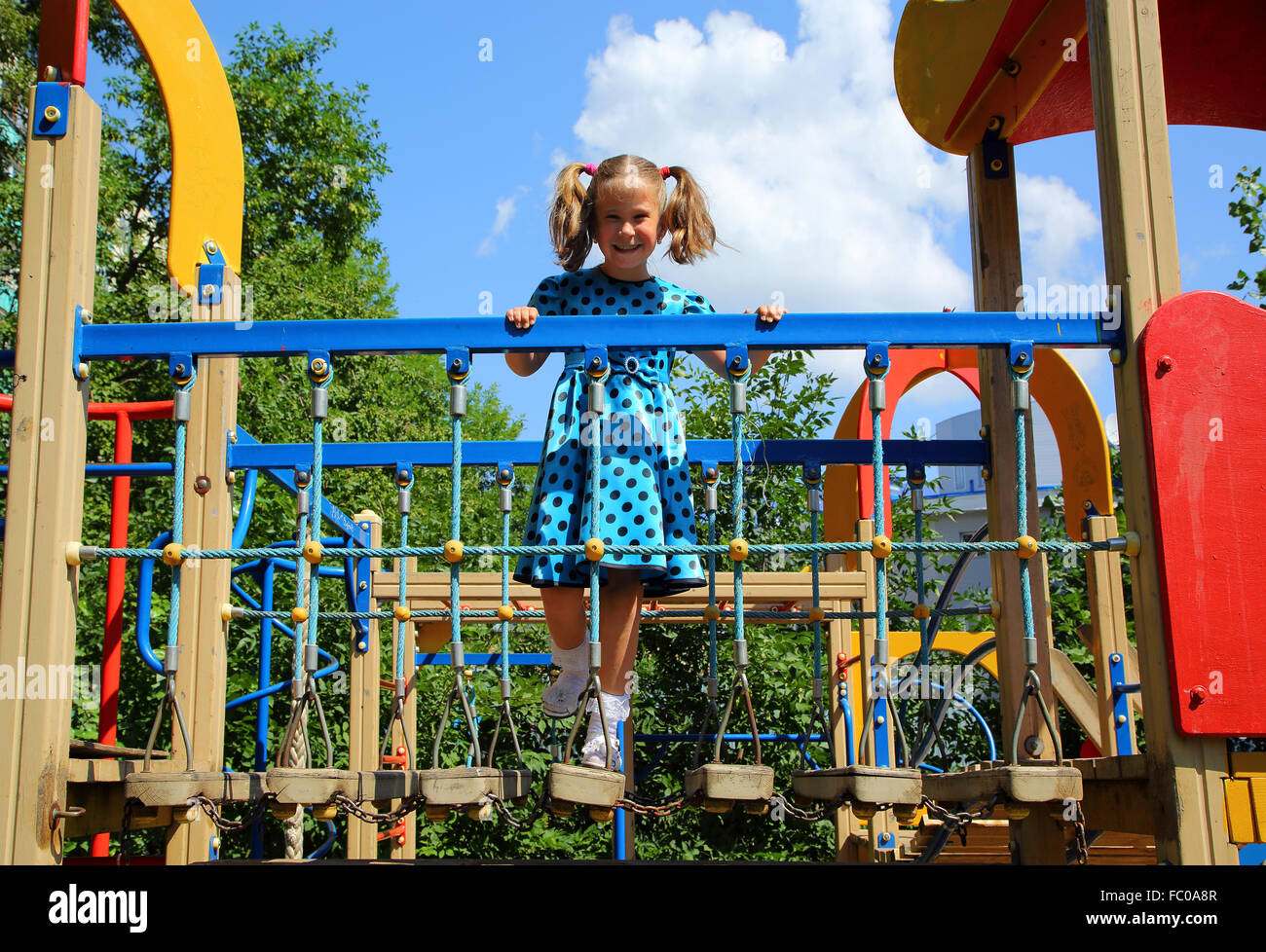 happy little girl on playground Stock Photo - Alamy