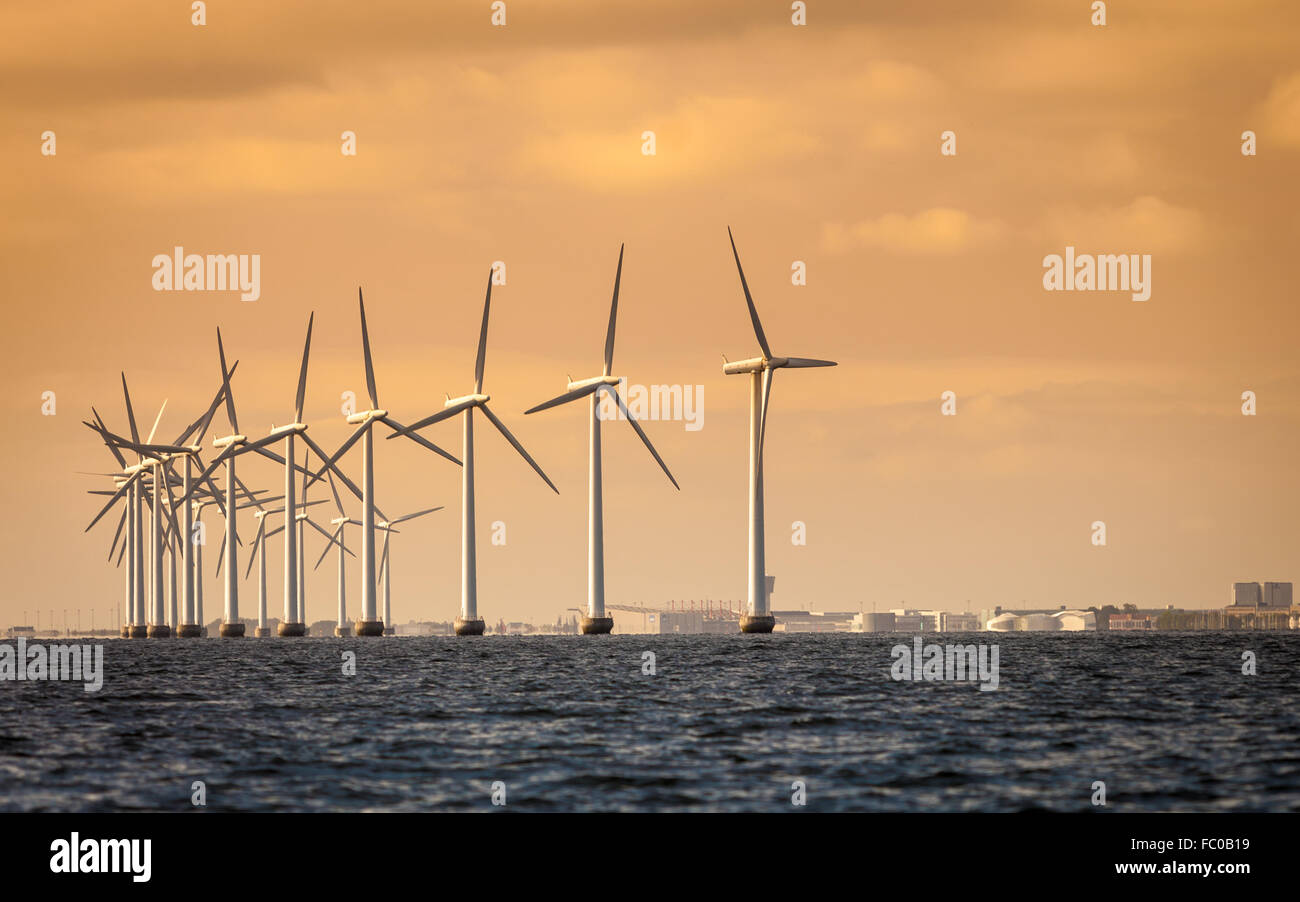 wind turbines power generator farm along coast sea Stock Photo