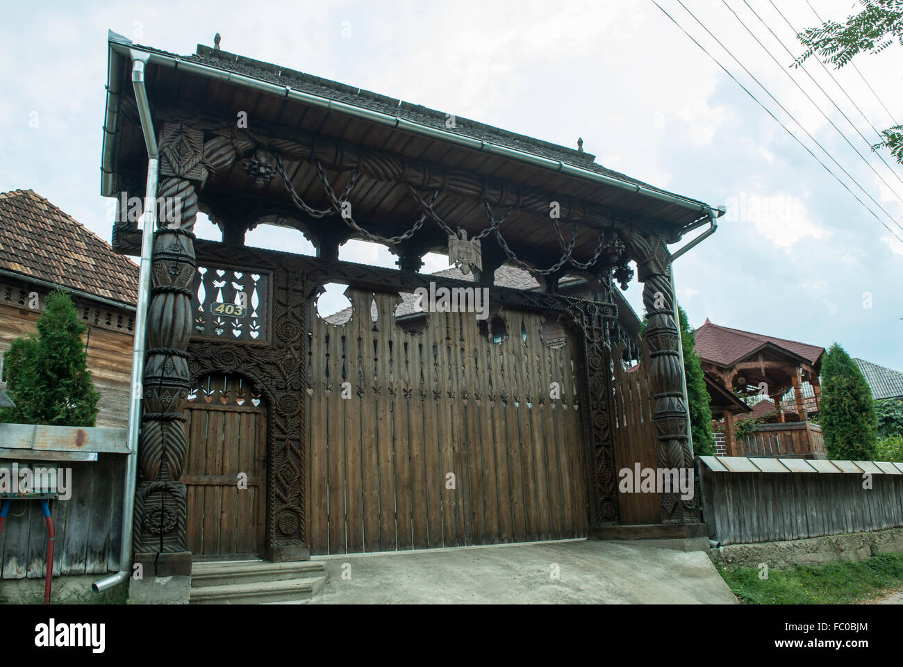 Typical wooden door carved in the district of Maramures, Romania Stock Photo