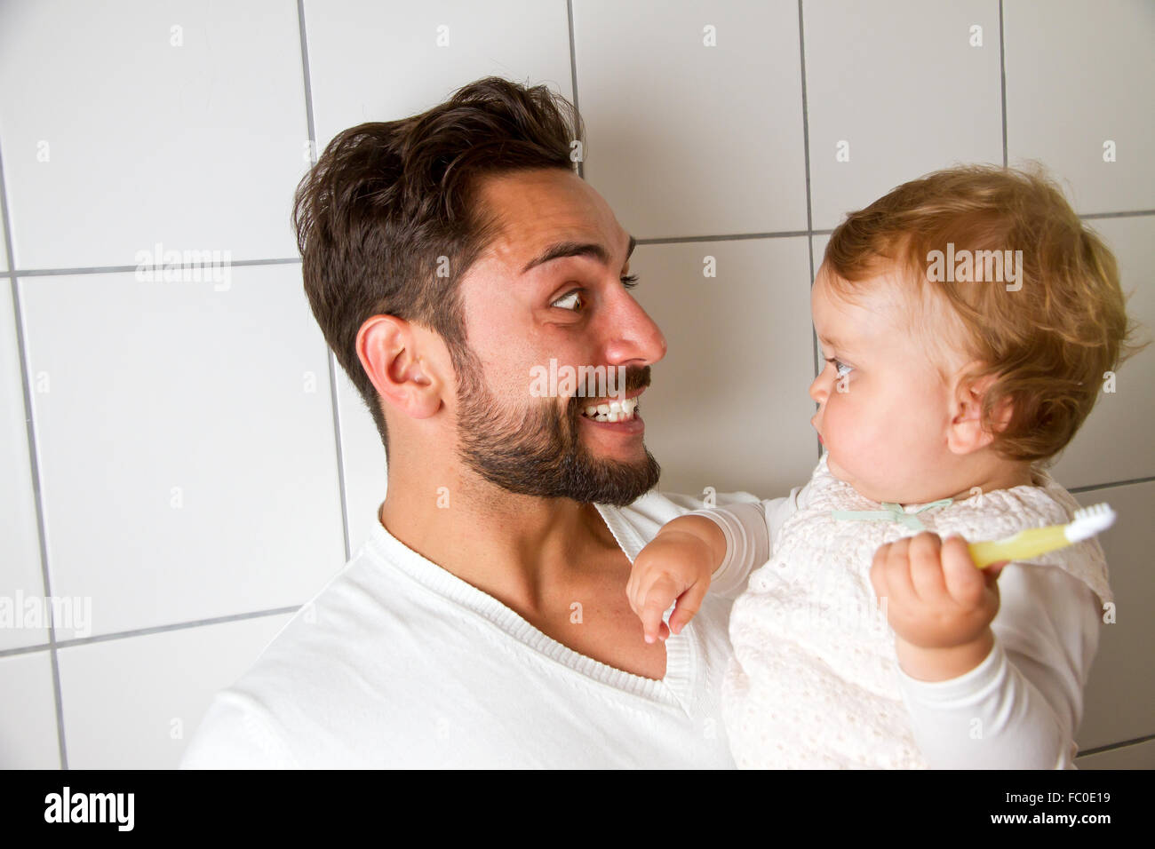 Vater with child in bathroom Stock Photo
