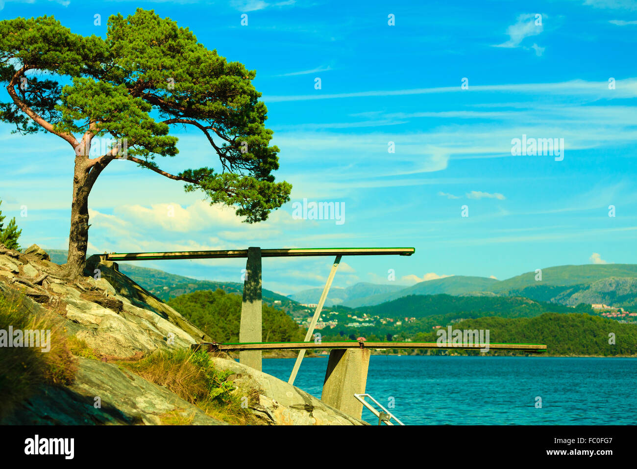 View of diving board. Springboard to dive at water. Stock Photo