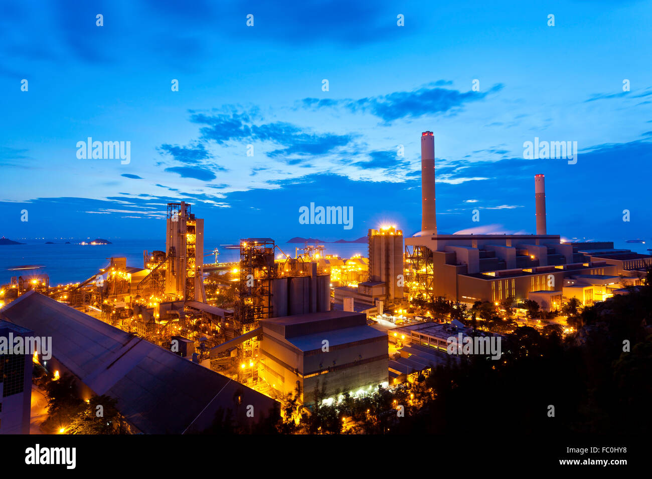 Petrochemical oil refinery plant at night Stock Photo