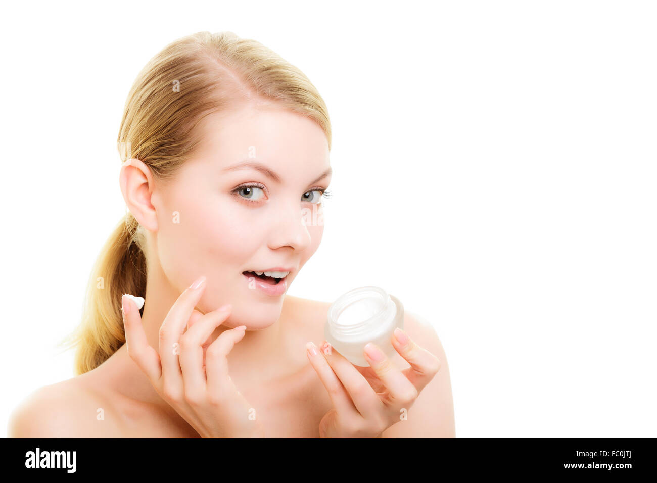 Skin care. Girl applying moisturizing cream Stock Photo