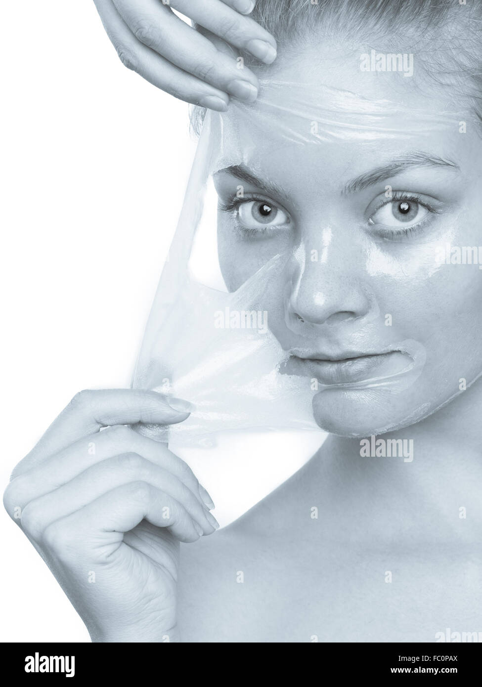 girl removing facial peel off mask Stock Photo Alamy