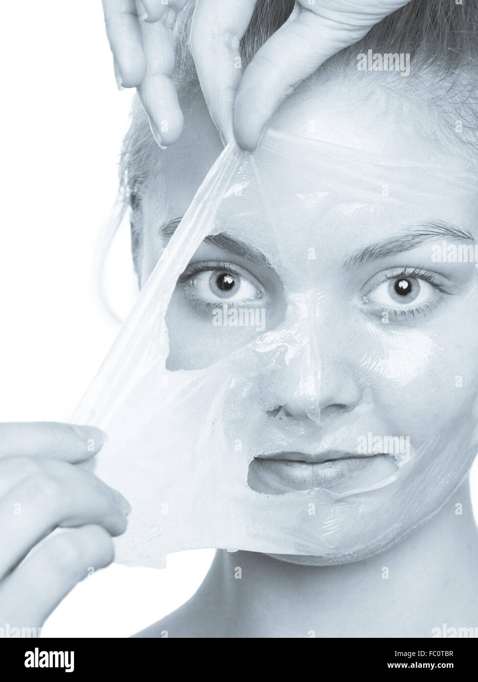 girl removing facial peel off mask Stock Photo Alamy