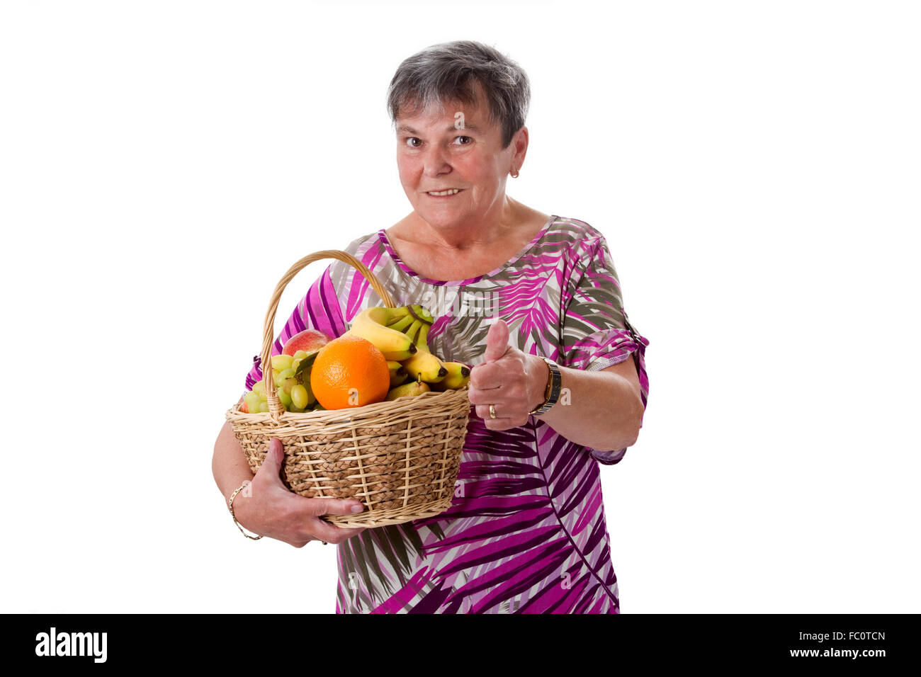 Woman holding fruit basket hi-res stock photography and images - Alamy