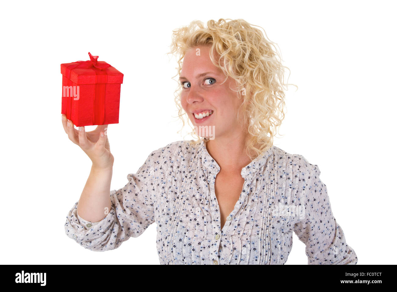 Young woman showing a gift Stock Photo