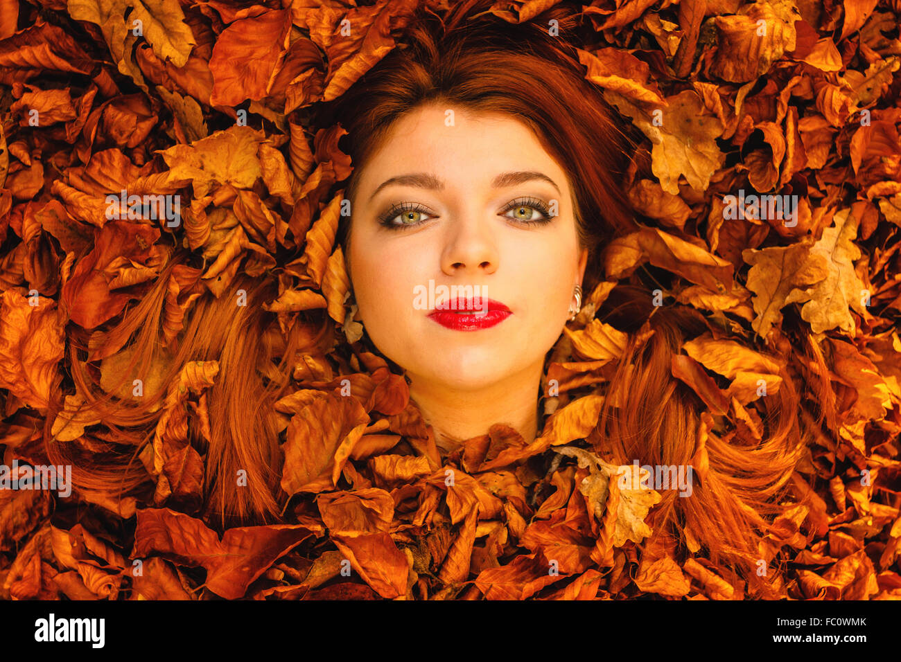 portrait-of-young-woman-in-autumn-leaves-stock-photo-alamy