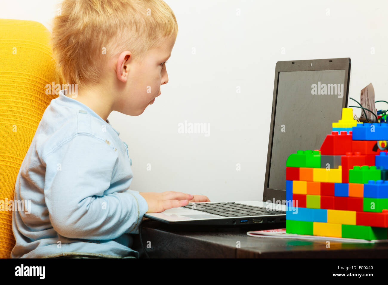little boy using laptop pc computer at home Stock Photo - Alamy