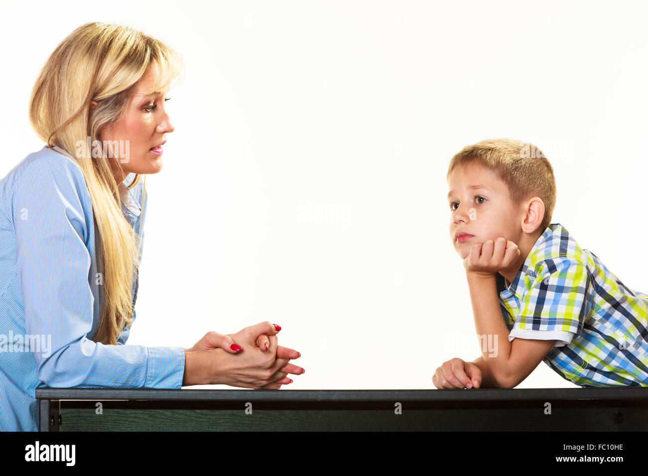 Mother talking with son. Children upbringing. Stock Photo