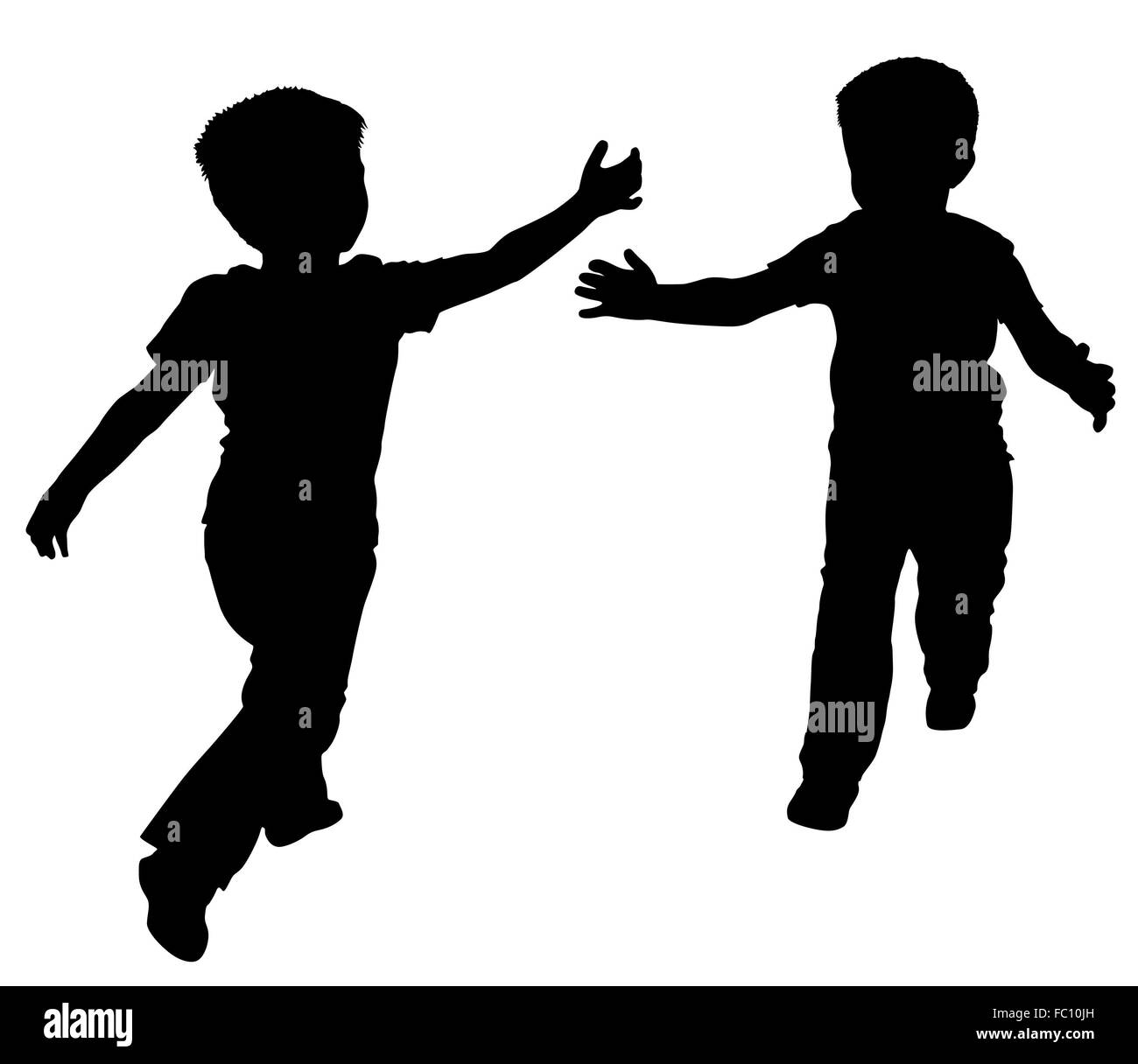 Silhouettes of two little boys Stock Photo