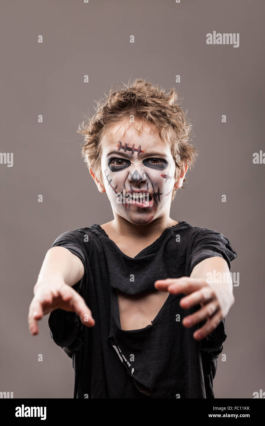 Screaming walking dead zombie child boy Stock Photo - Alamy