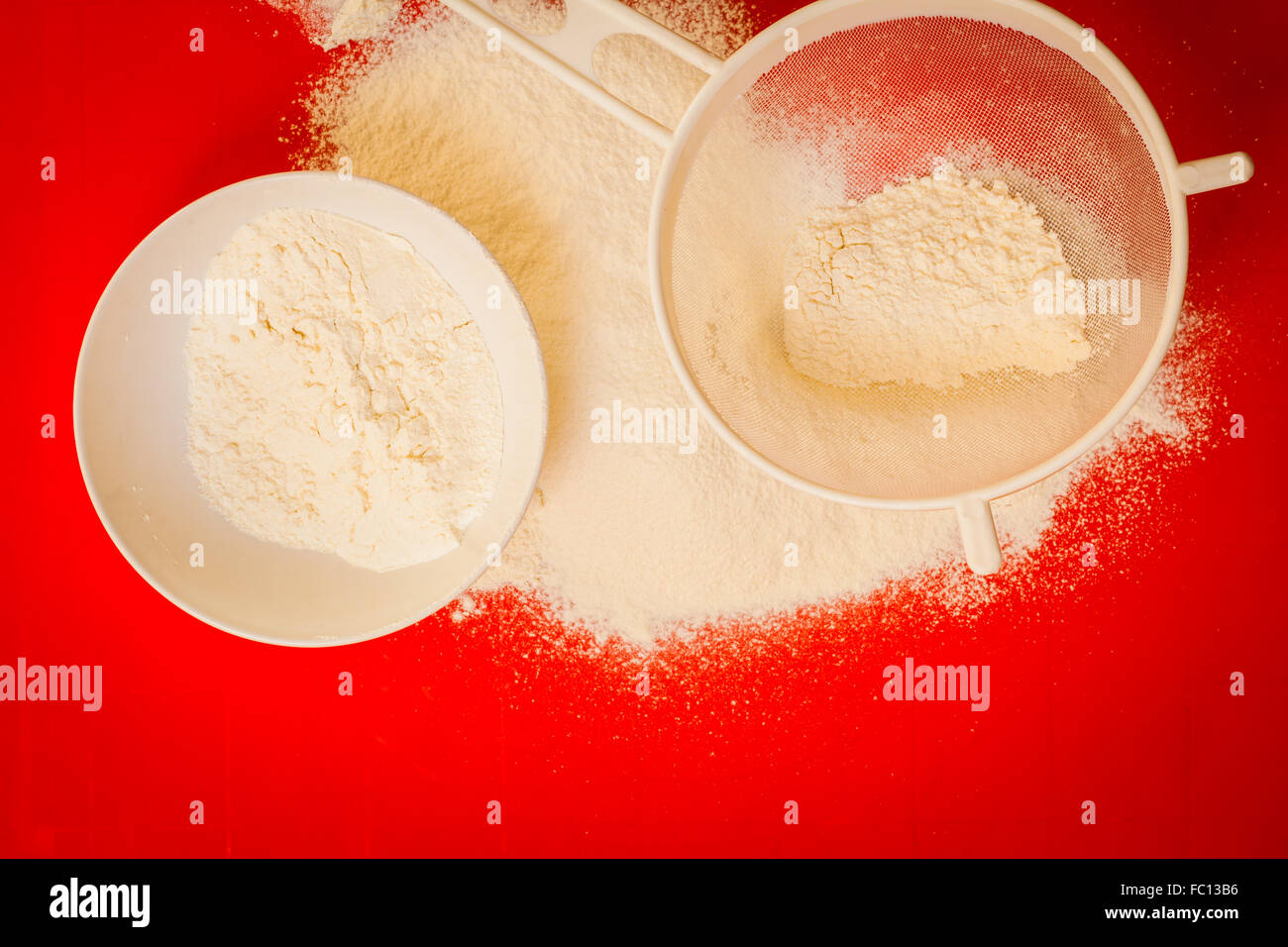 Preparation for baking, ingredients flour sifting Stock Photo Alamy