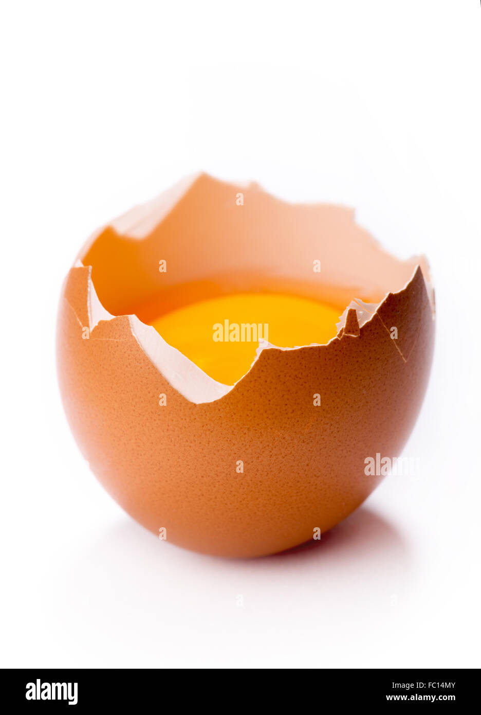 broken egg on white background Stock Photo - Alamy