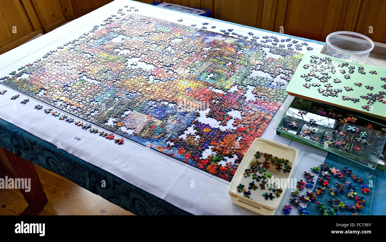 unfinished puzzle and separate parts Stock Photo