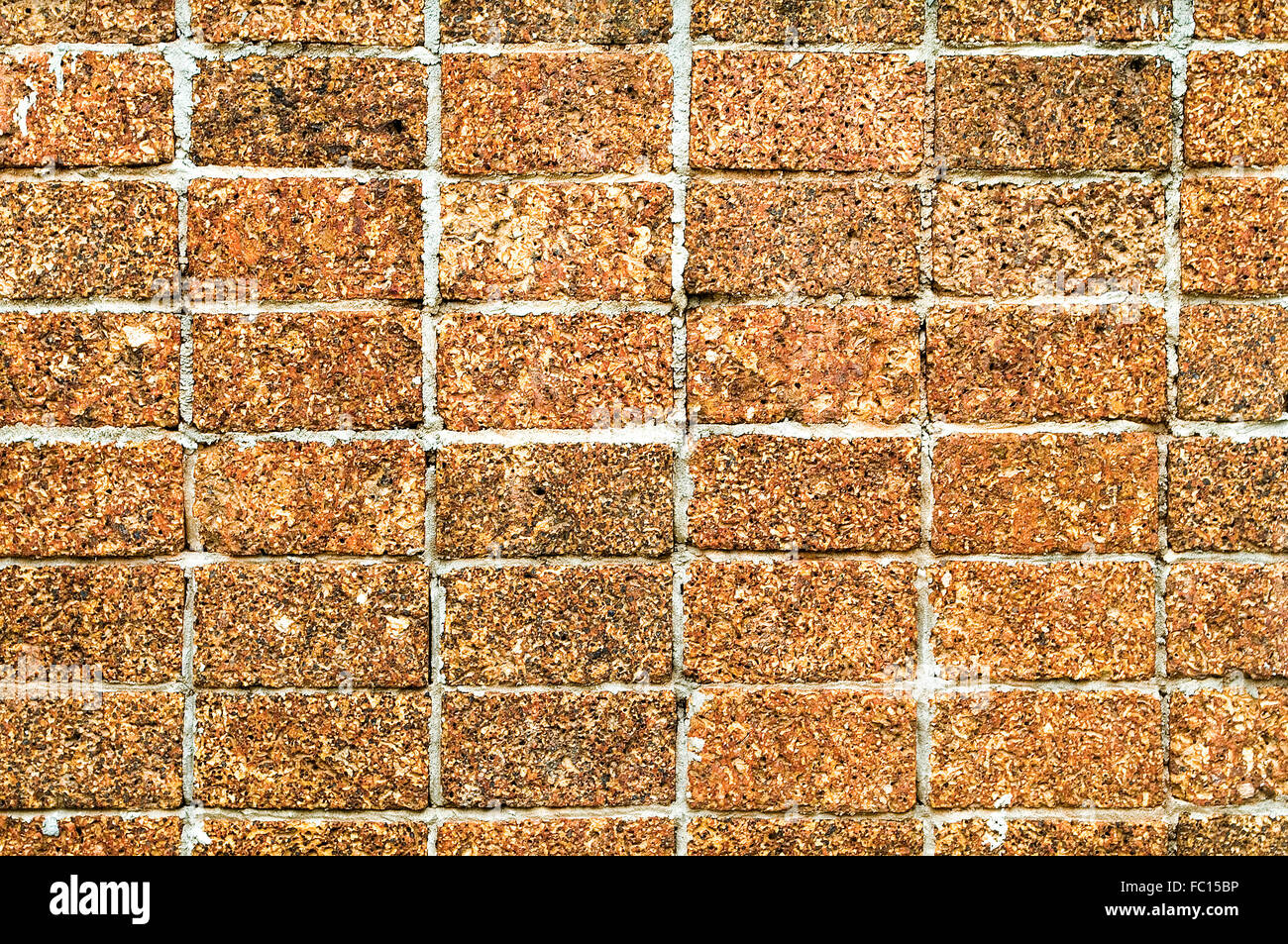 Laterite stone wall background and texture Stock Photo