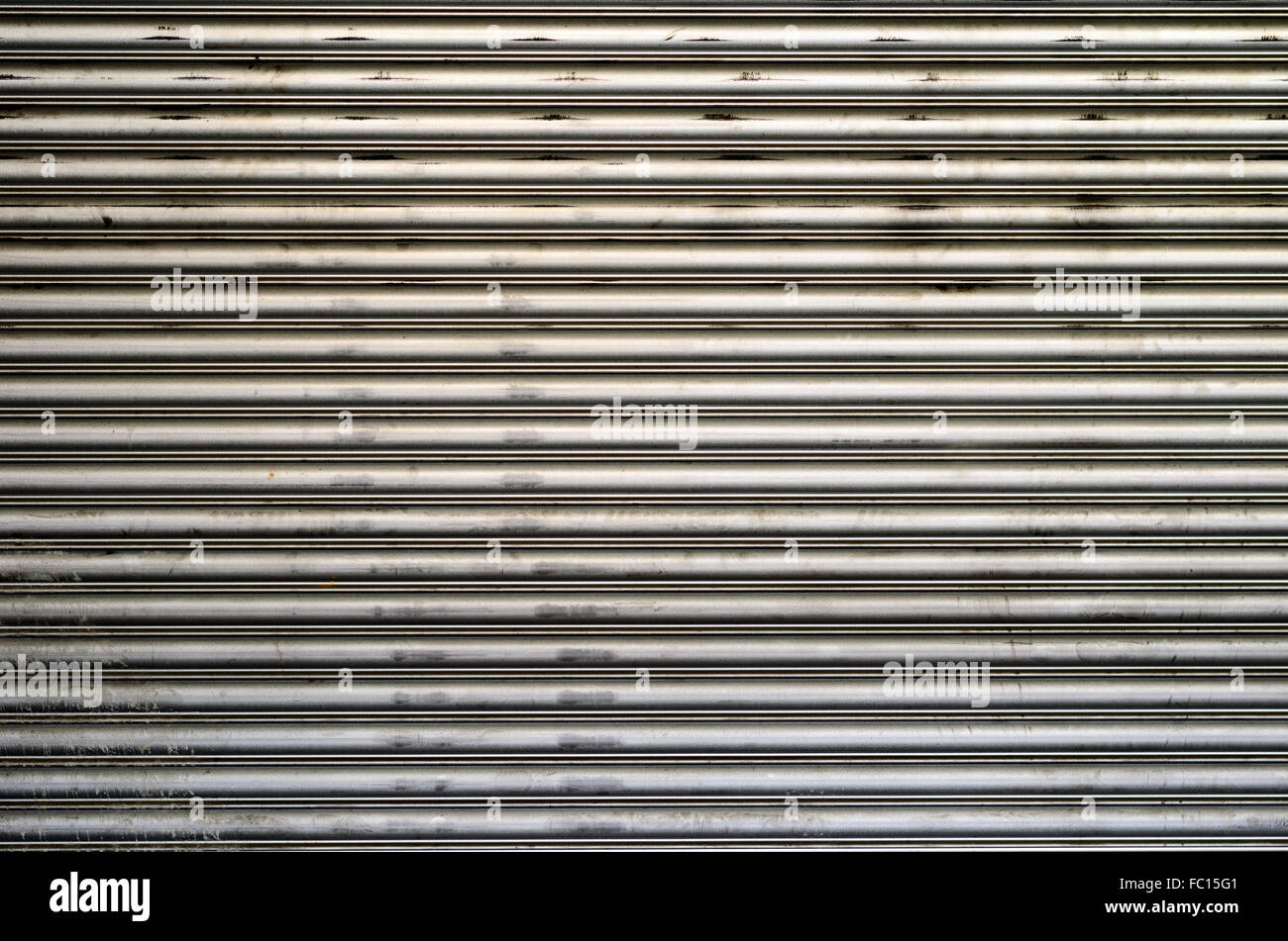 Background of rough corrugated sheet metal with dents for patterns and